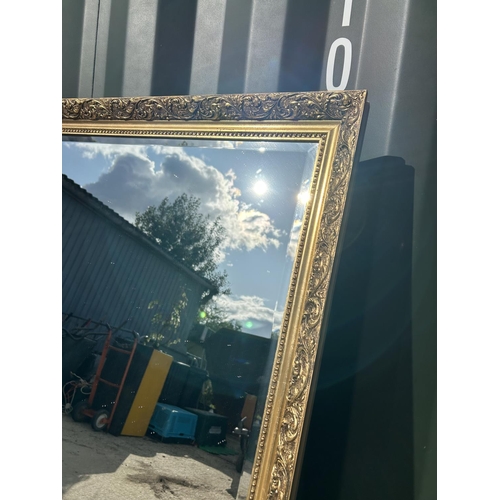 285 - A large gold gilt rectangular mirror 100x130 together with a gold gilt framed overmantle