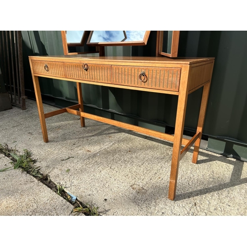 290 - A mid century teak three drawer dressing table