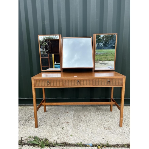 290 - A mid century teak three drawer dressing table