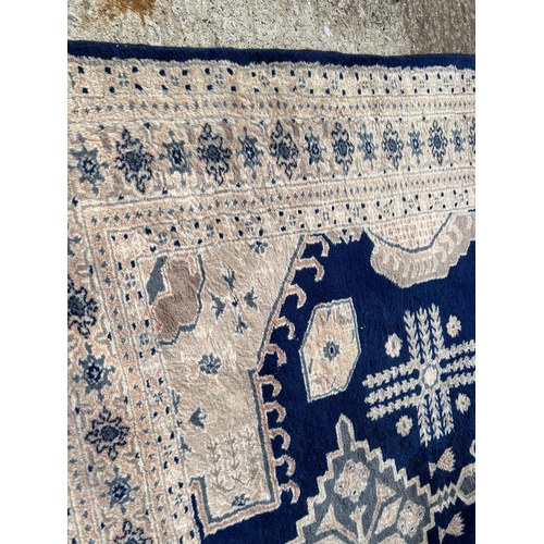 300 - A large blue pattern carpet 182x275