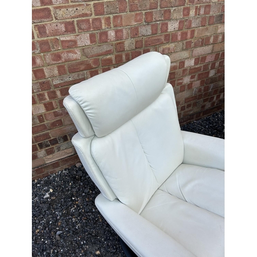 311 - A pair of white leather EKORNES stressless white leather reclining armchairs