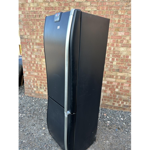 328 - A Black hoover fridge freezer with wave shape front