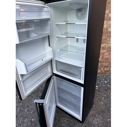 328 - A Black hoover fridge freezer with wave shape front