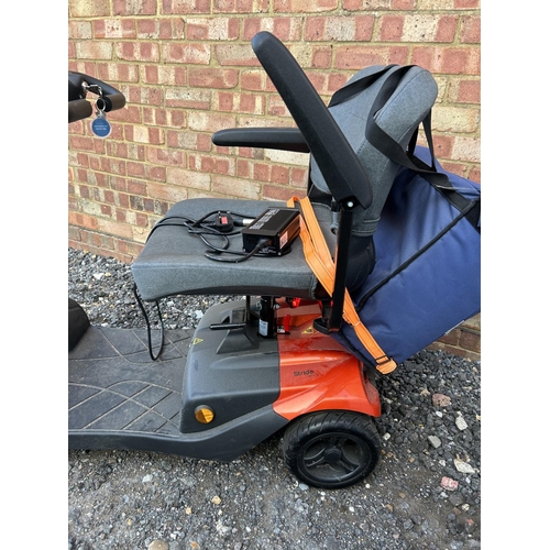 331 - A STRIDE sport mobility scooter in good working order with key and charger