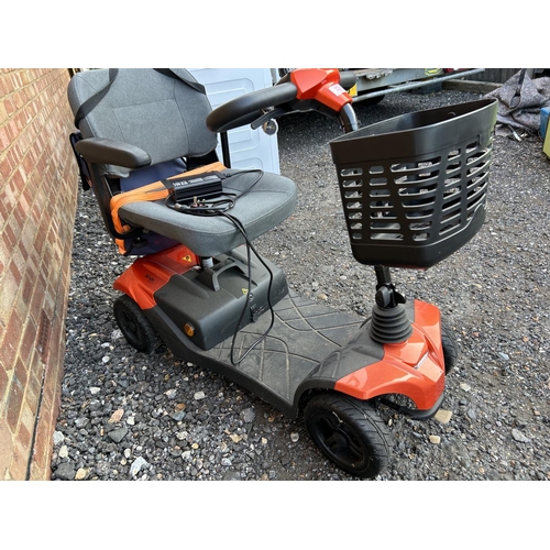 331 - A STRIDE sport mobility scooter in good working order with key and charger