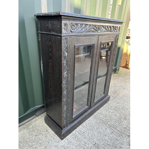 346 - A carved oak two door cabinet 90x30x110