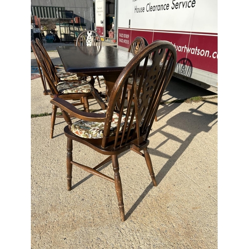 351 - An ercol style refectory dining table together with a set of 6 wheelback chairs (inc. 2 carvers)