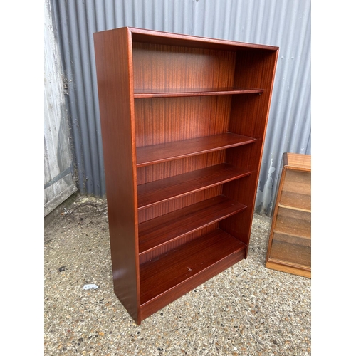 46 - A teak bookcases by turnridge with adjustable shelves together with a deco style glazed bookcase wit... 