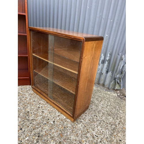 46 - A teak bookcases by turnridge with adjustable shelves together with a deco style glazed bookcase wit... 