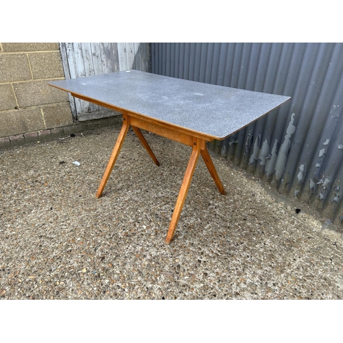 48 - An unusual mid century kitchen table with grey formica top and splayed legs possibly BY KANDYA 67x12... 