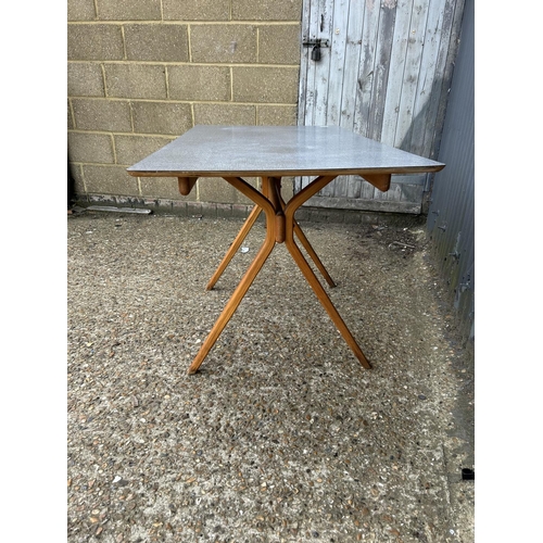 48 - An unusual mid century kitchen table with grey formica top and splayed legs possibly BY KANDYA 67x12... 