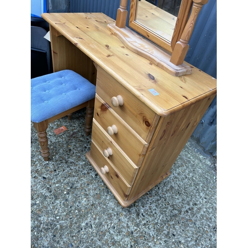 51 - A solid pine four drawer kneehole desk with swing mirror and stool