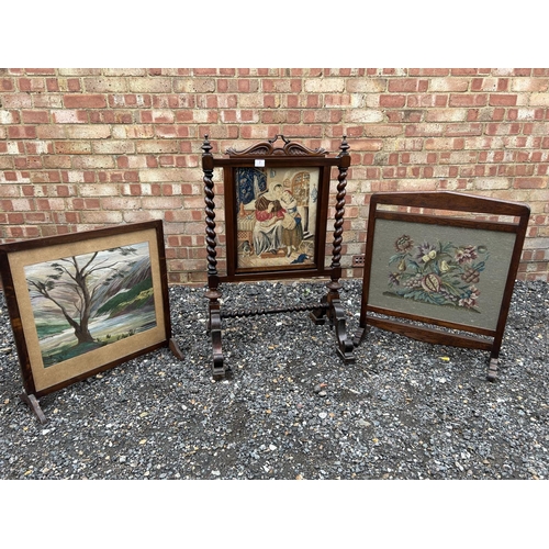 7 - A victorian rosewood fire screen with removable glazed tappestry panel, together with two other oak ... 