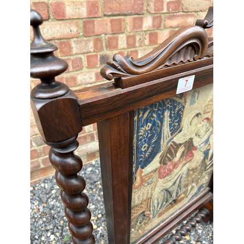 7 - A victorian rosewood fire screen with removable glazed tappestry panel, together with two other oak ... 