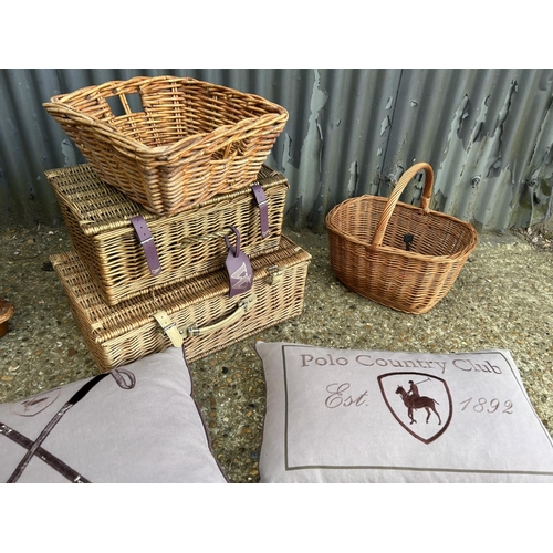 87 - Three wicker baskets, two Ralph Lauren cushions and a pine blanket box with blankets