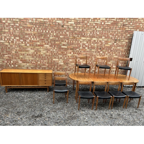 9 - A Danish teak dining suite from the Nils Jonsson Troeds range consisting of the 'ODEN' sideboard, 9 ... 