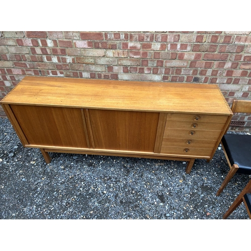 9 - A Danish teak dining suite from the Nils Jonsson Troeds range consisting of the 'ODEN' sideboard, 9 ... 