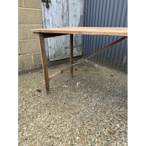 92 - A vintage wooden folding tressel  table