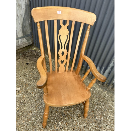 95 - A pine Windsor style pine carver chair