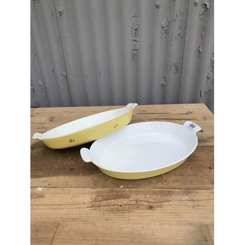 694 - Le Creuset plain yellow oven dish  41 x 26 cms and one other cast iron oven dish