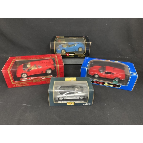 843 - Four boxed Model Sports Cars