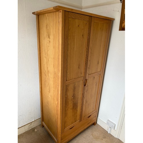 110 - A pair of light oak double wardrobes with drawer (currently dismantled)