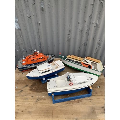 465H - Radio control plastic model lifeboat length 48 cms and 3 other radio control boats all complete with... 