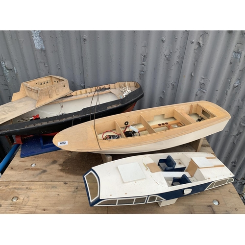 465I - Two incomplete radio control model boats, longest 86 cms (2)