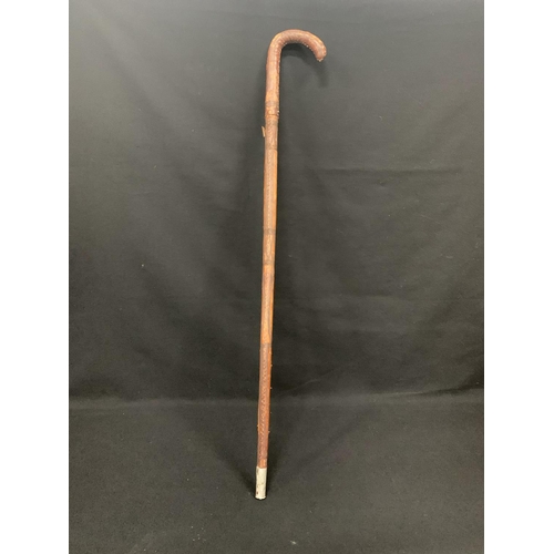 554 - Leather covered sword stick, 86cms long