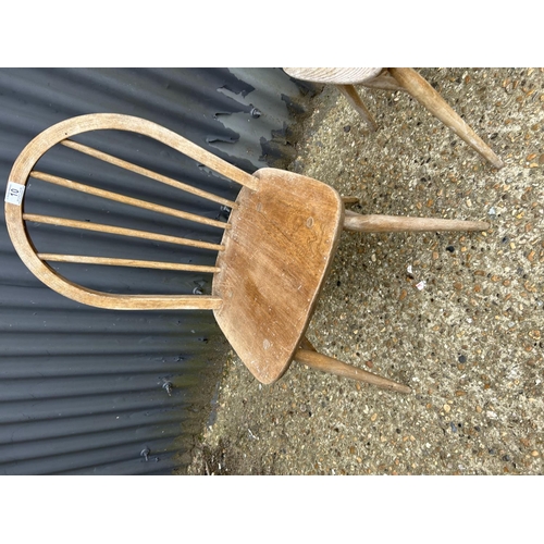 10 - A pair of ercol stick back chairs