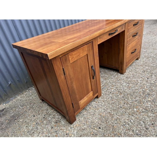 111 - A large modern hardwood desk 165x 65x77