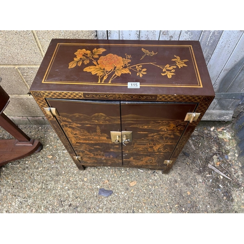 115 - A small lacquered oriental two door cupboard  58x29x80