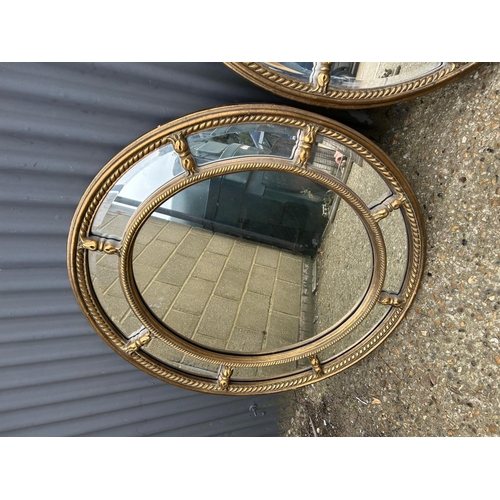 122 - A pair of ornate gold gilt oval mirrors 80x95