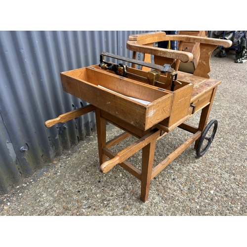 127 - A 20th century oak JOCKEY SCALE seated weighing scales