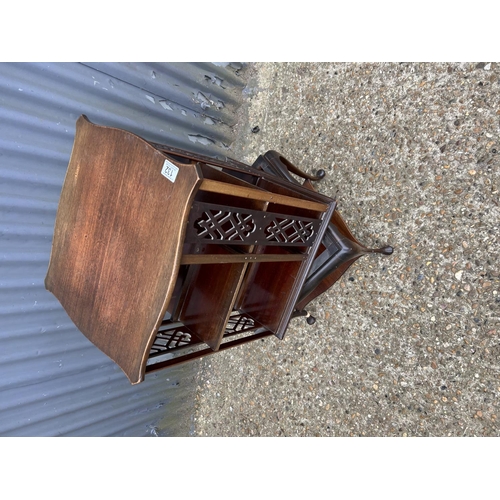 132 - An ornate mahogany revolving bookcase