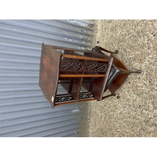 132 - An ornate mahogany revolving bookcase