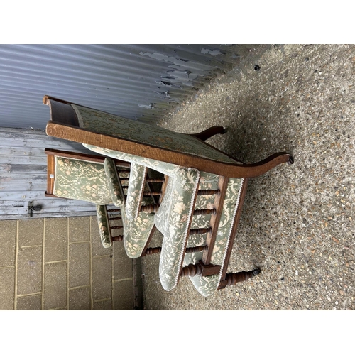 135 - A pair of Edwardian oak framed chairs with green pattern upholstery