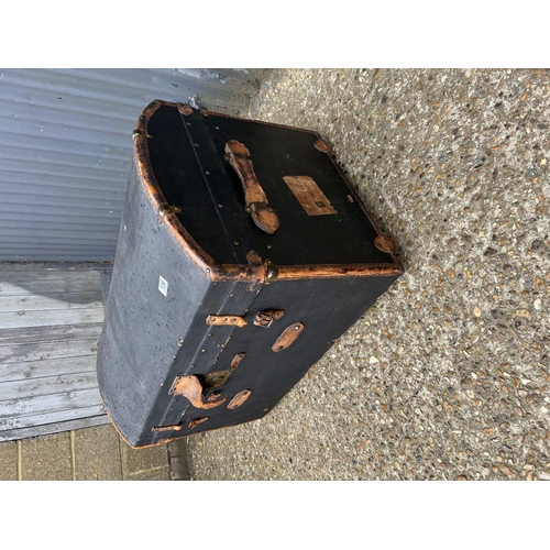 136 - A vintage blue domed trunk containing curtains