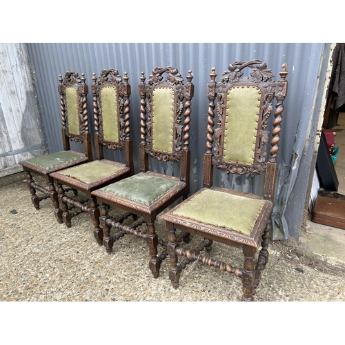 14 - A set of four French oak dining chairs with barley twist and carved backs