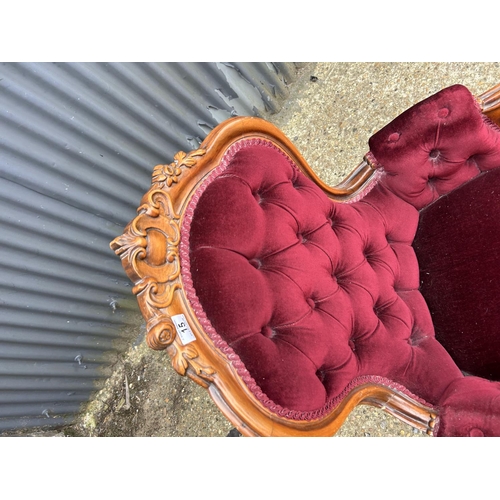 15 - A mahogany framed bedroom chair with red button upholstery