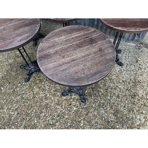 156 - Five circular pub tables with ornate cast iron bases 56 cm diameter