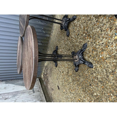 156 - Five circular pub tables with ornate cast iron bases 56 cm diameter