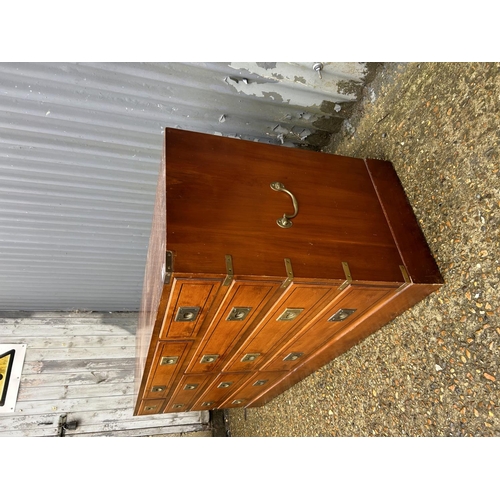 165 - A reproduction yew wood military style lowboy chest of nine drawers 150x42x70