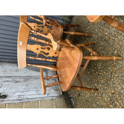 171 - A set of four pine kitchen chairs (2 carvers)