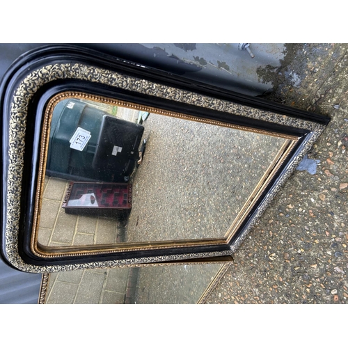 173 - A black mirror and a gilt framed mirror