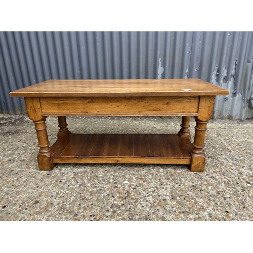 18 - A reproduction oak coffee table with storage 100x 45 x47