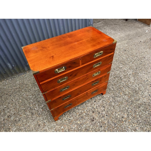 19 - A reproduction yew military style secretaire chest with fitted interior, leather surface  and concea... 