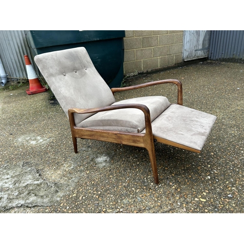 191 - A mid century danish style teak framed east chair with foot rest