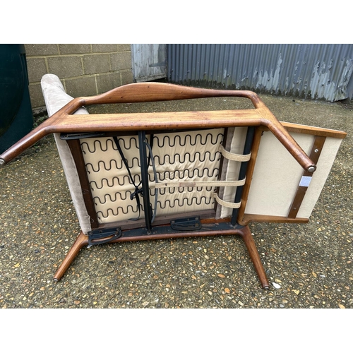 191 - A mid century danish style teak framed east chair with foot rest