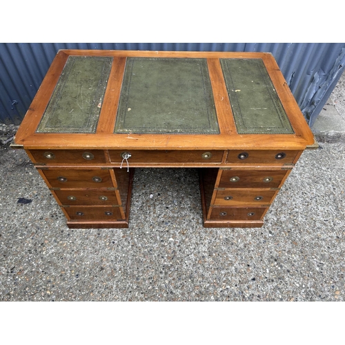 2 - A reproduction yew military style twin pedestal desk with green leather top 122x77x75